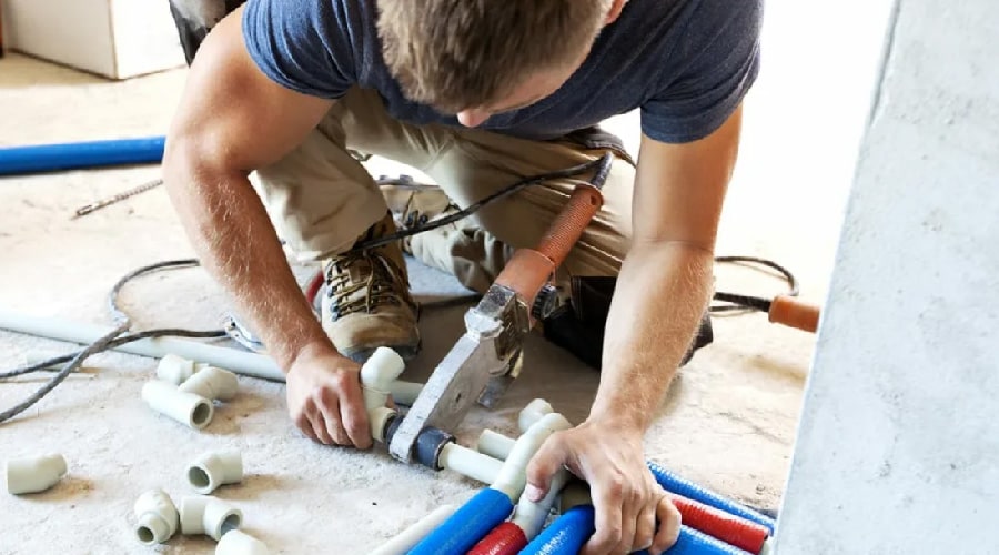 plumber installing pipes